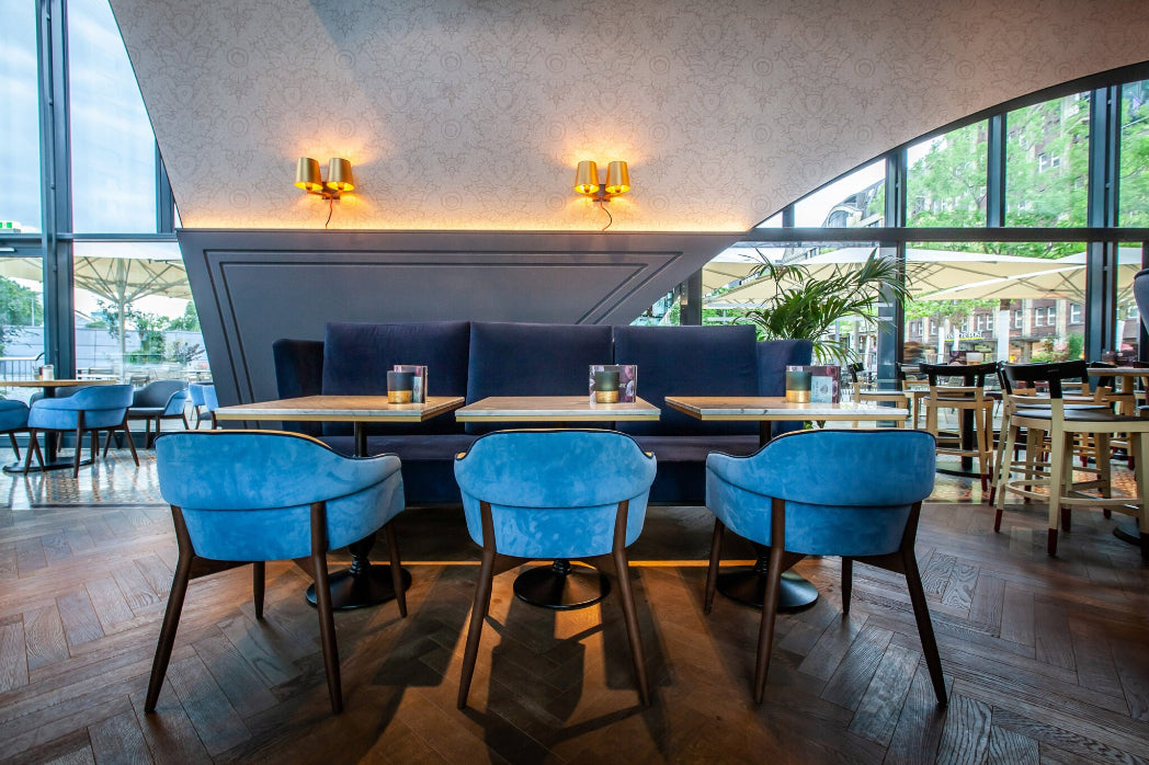 blue restaurant chairs on hardwood flooring