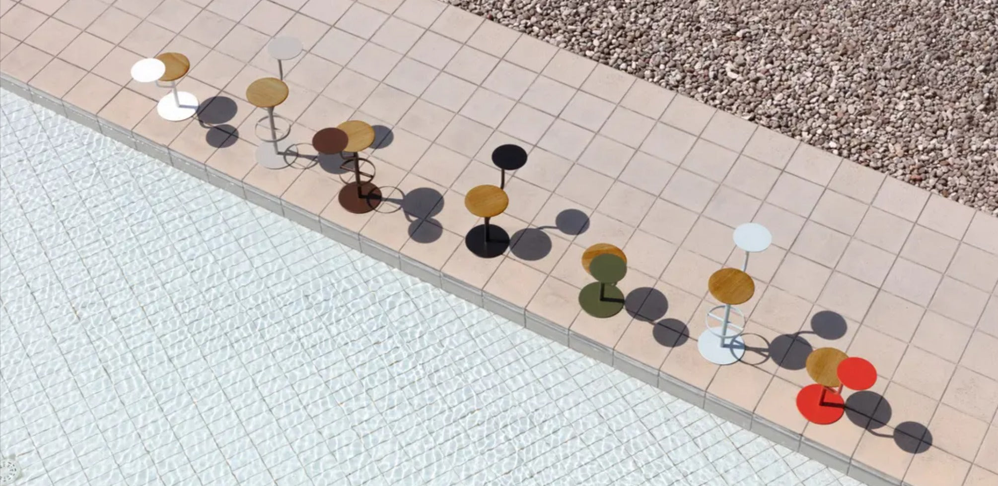 Unique modern swivel bar stools near pool