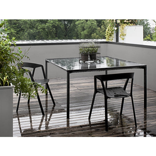 Compass chairs by Kristalia in black outdoors