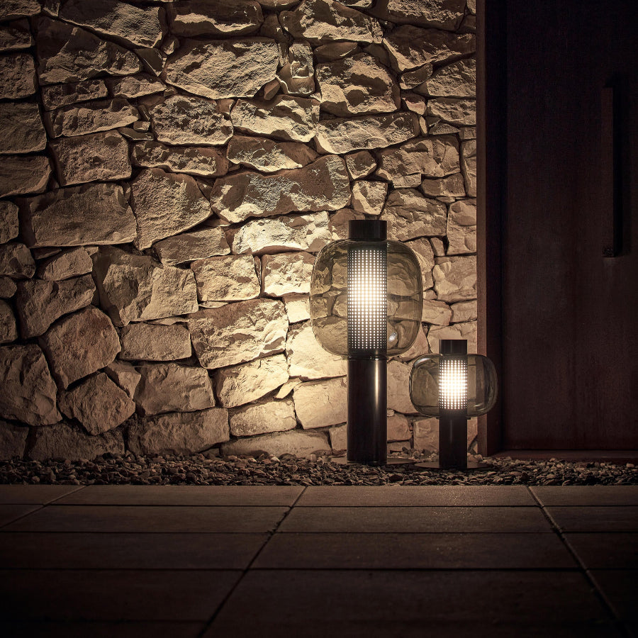 bonbori outdoor lamp against a stone wall