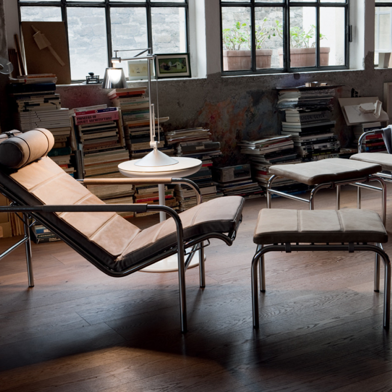 Genni Lounge Chair and footrest in brown leather