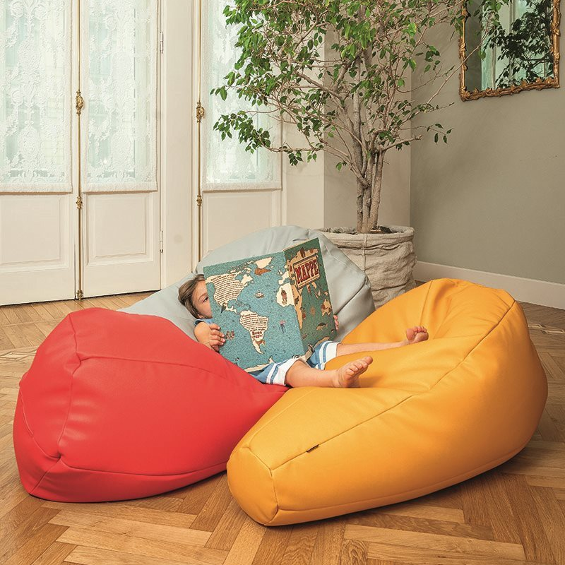 Child sitting on Sacco Bean Bags by Zanotta