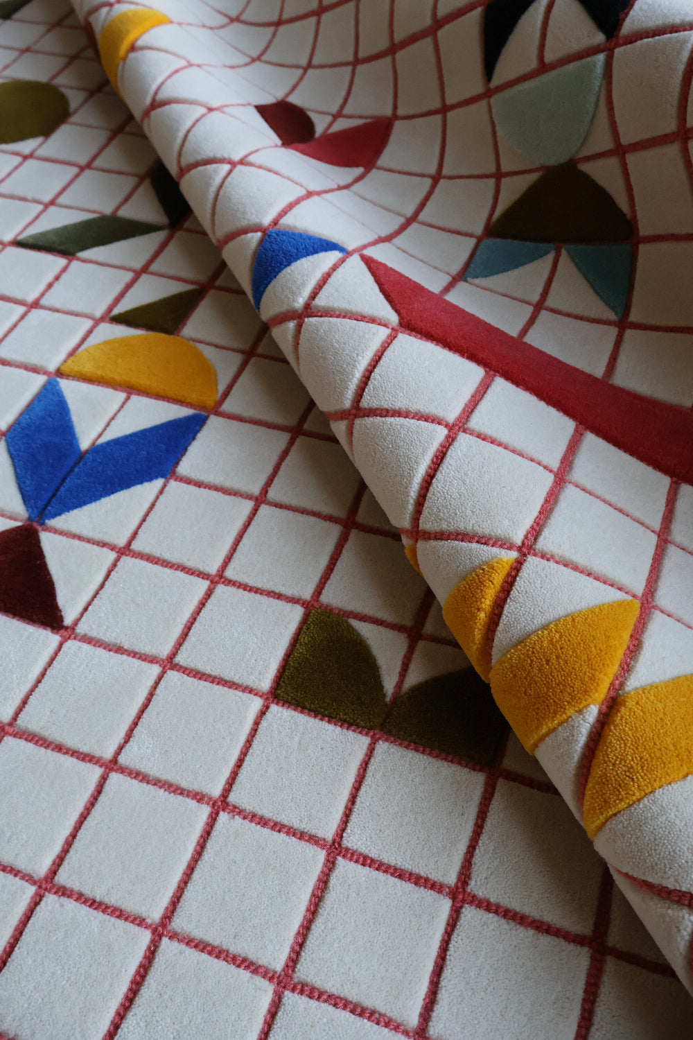Close-up of fabric with geometric pattern on a grid background