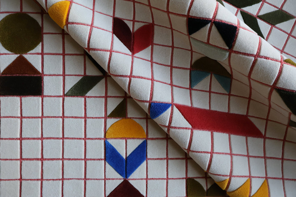 Fabric with geometric pattern on a grid background