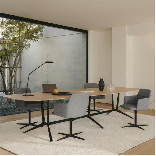 contemporary dining table and upholstered chairs in modern luxury office setting