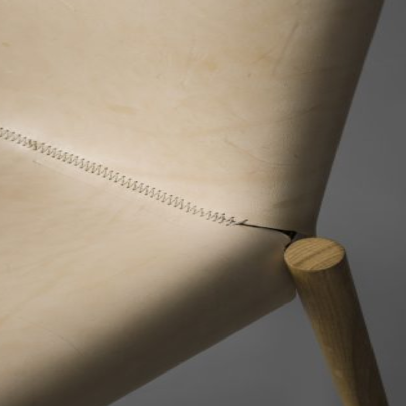 Closeup details of Natural 1085 Edition Leather Chair by Kristalia