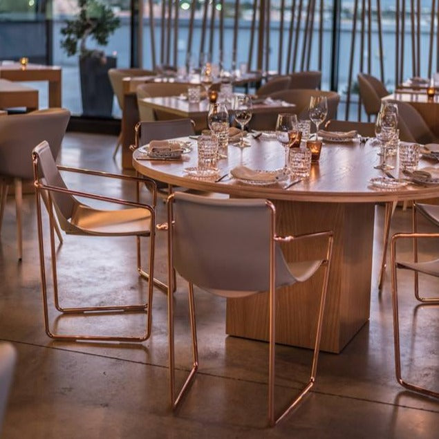 Apelle leather armchairs around table in restaurant