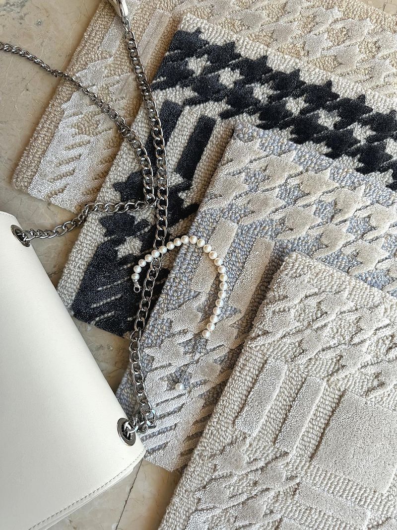 Plaid Chanel rug by Volver Studios