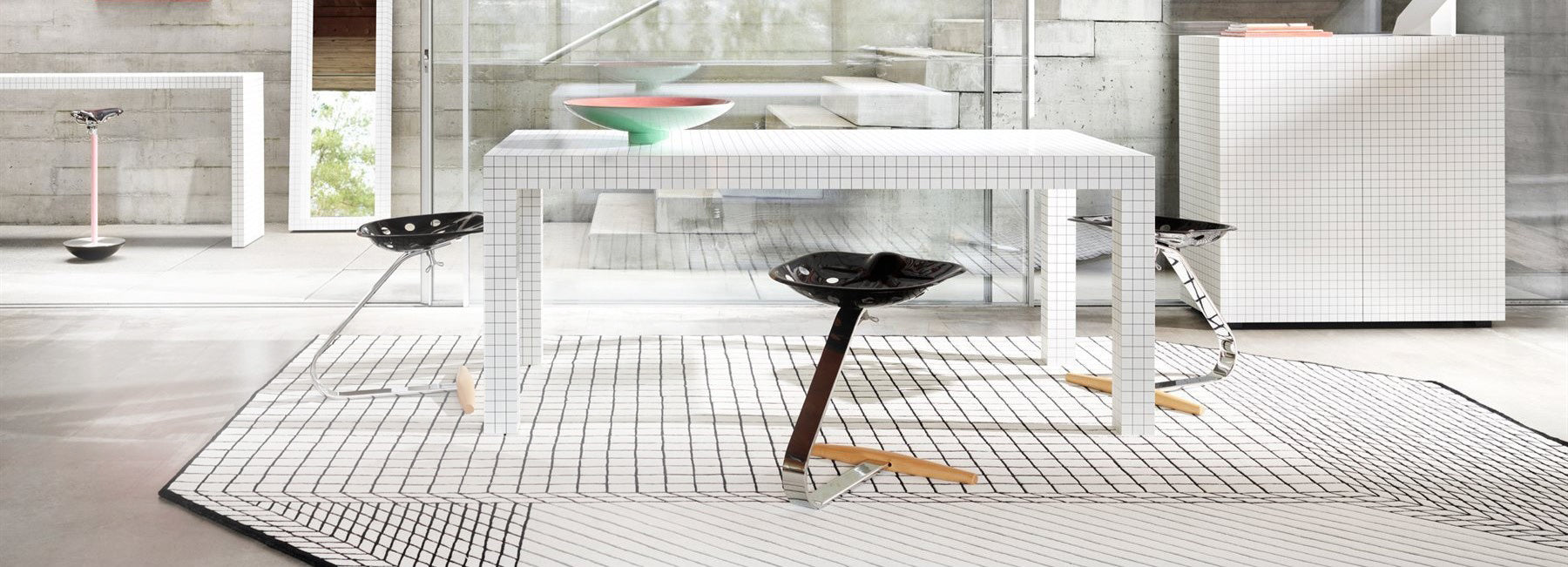 dining room furnished with Italian iconic furntiure by Zanotta, quaderna, mezzadro