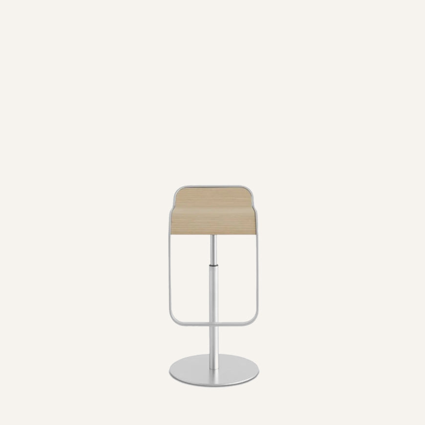Modern bar stool with beige seat and metal base on a white background