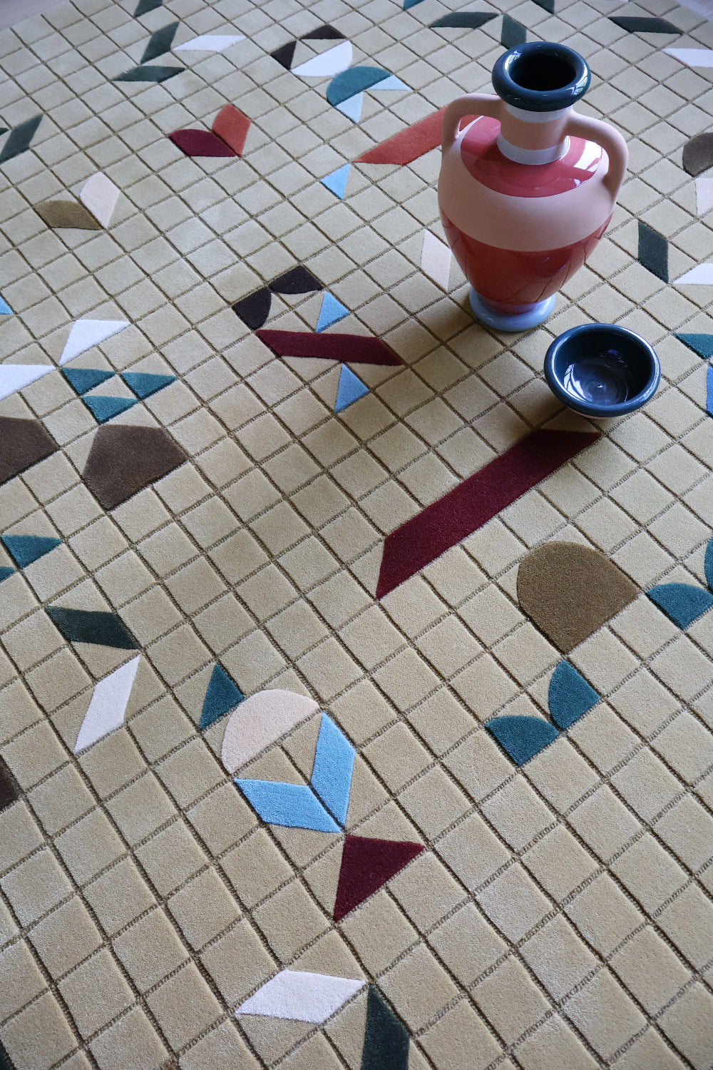 Decorative vase on a patterned rug