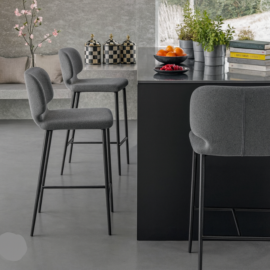 Modern kitchen with gray bar stools and a black island.