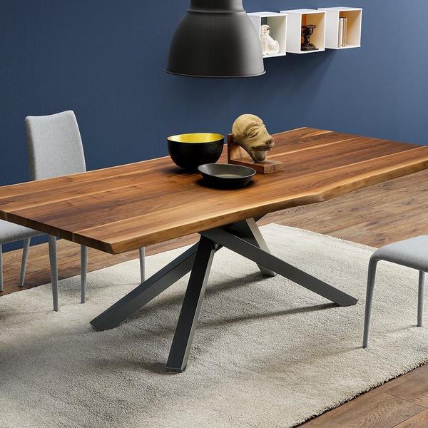 Solid walnut dining table with chairs in modern room